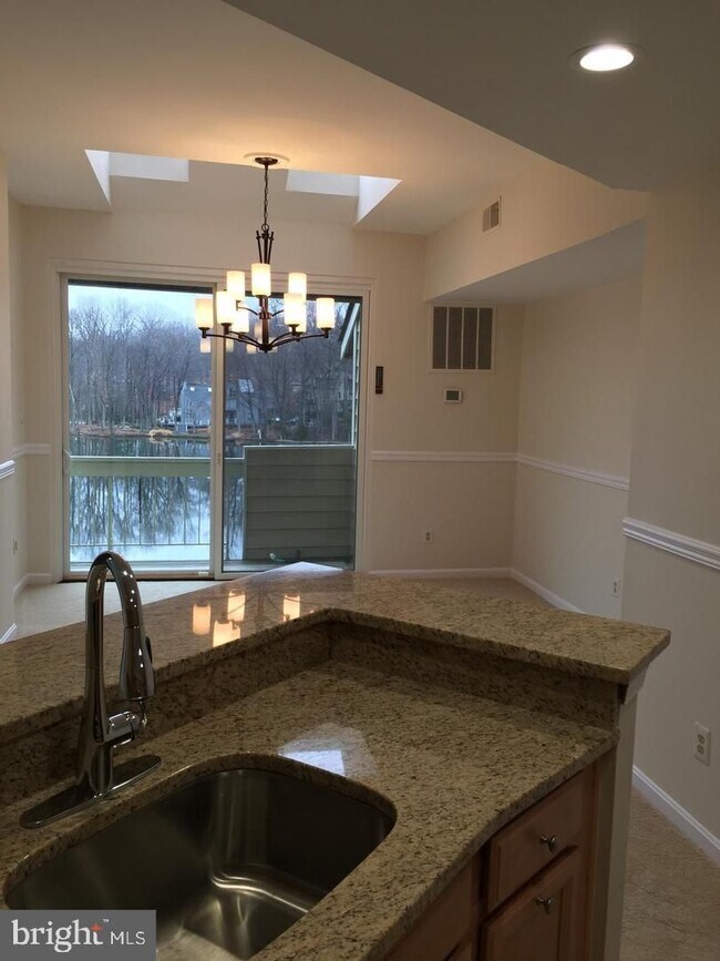 Building Photo - This is a rare opportunity to enjoy lakeside living in one of Northern Virginia’s most desirable ...