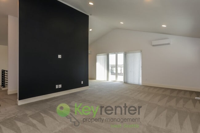 Building Photo - Spacious Living with Balconies, Deck, and Private Yard