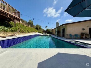 Building Photo - Luxury Furnished 4 Bedroom Home with Pool ...