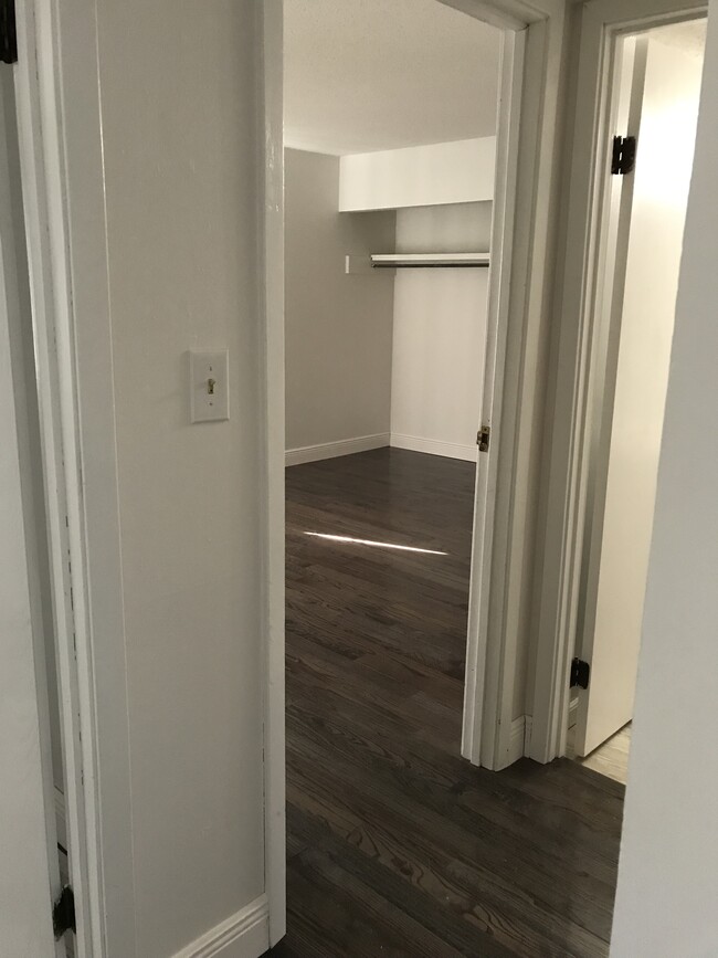 Newly white painted room with hard wood floors - 101 Old Ferry Rd