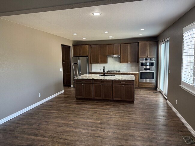 Building Photo - Greenbelt-Backed Wheatlands Home - Mountain Views, 3 Car Garage & Finished Basement
