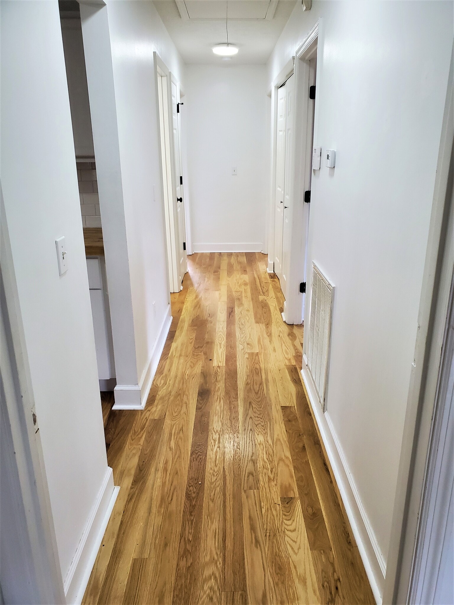 Hallway with laundry room - Washer and Dryer are included and present in the home. - 1025 Wade Ave