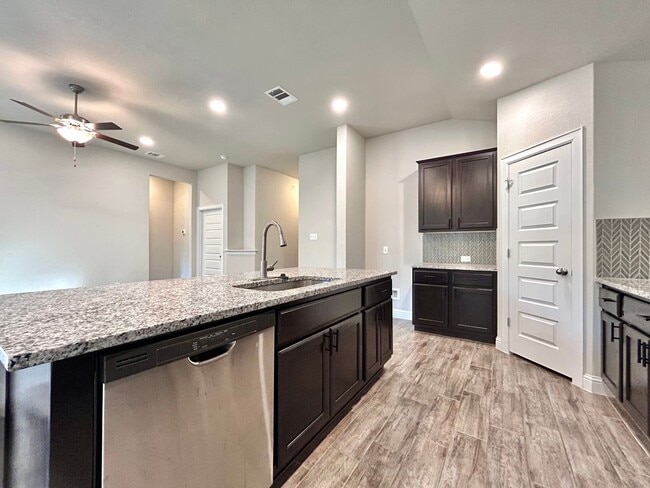 Building Photo - Charming 4/BR 2/BA Home with 2-Car Garage and Private Fenced Backyard