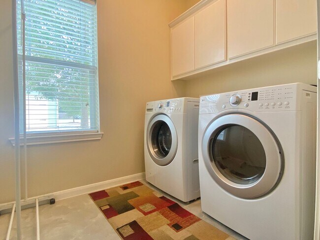 Building Photo - This charming two-story home, built in 2018, offers a spacious open floor plan perfect for casual...