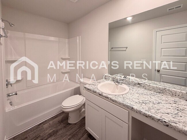 Building Photo - Spacious Two-Story Townhome with Open Layout!