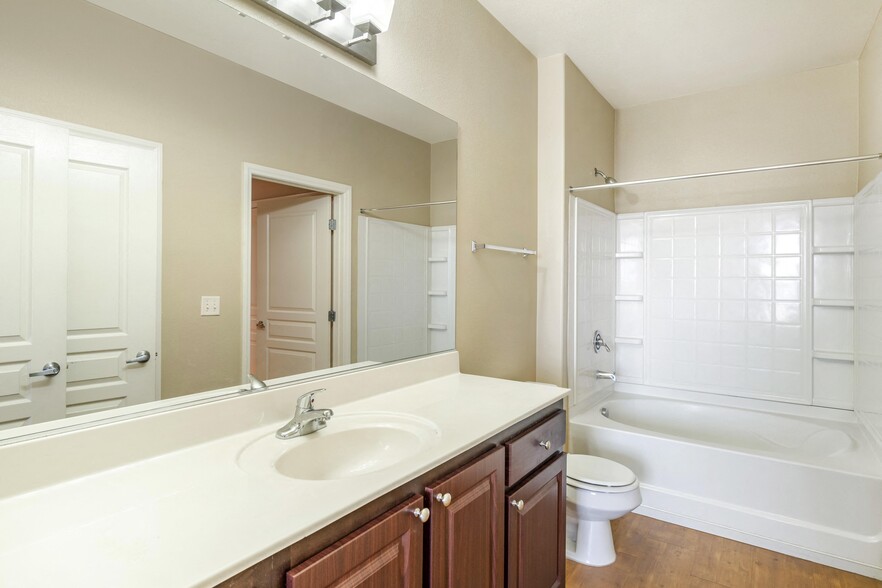 A Sonata suite offers a sleek bathroom with a sink and bathtub for your comfort - Sonata Apartment Homes