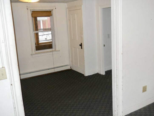 Living Room, View 1 (closet houses washer and dryer) - 127 N Winooski Ave