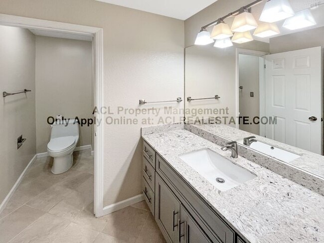 Building Photo - Bright 2BR/2BA Condo with Garage & Pool in...