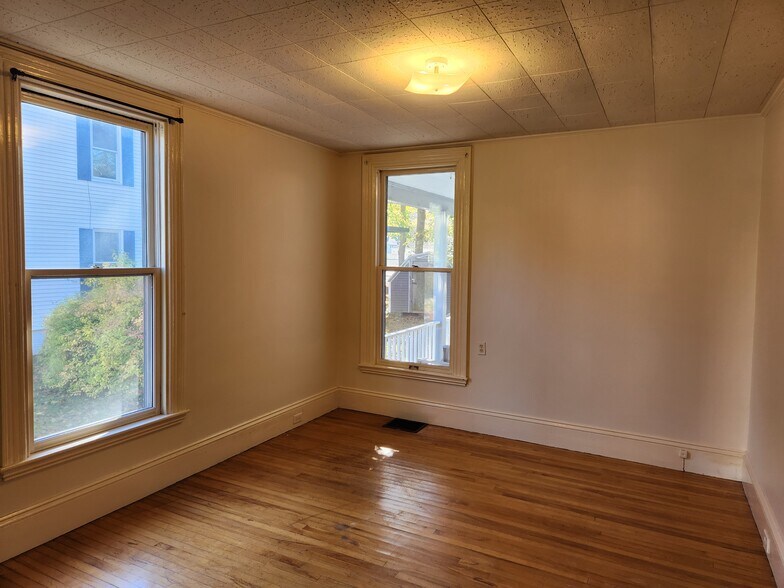 Bedroom 2 with closet—overseeing back porch - 46 Saunders St