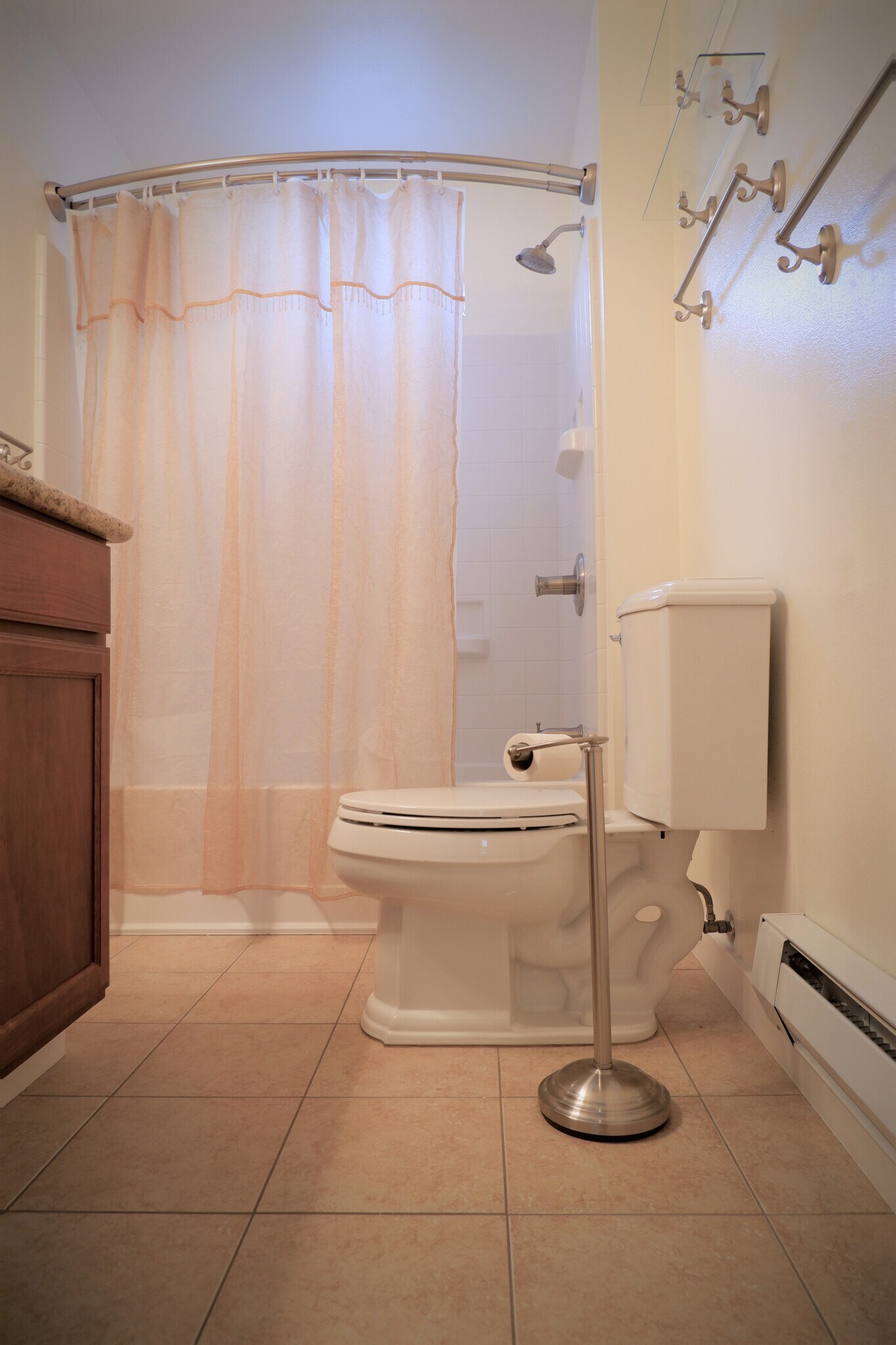 Updated bathroom with tile floor - 3517 E 32nd Ave