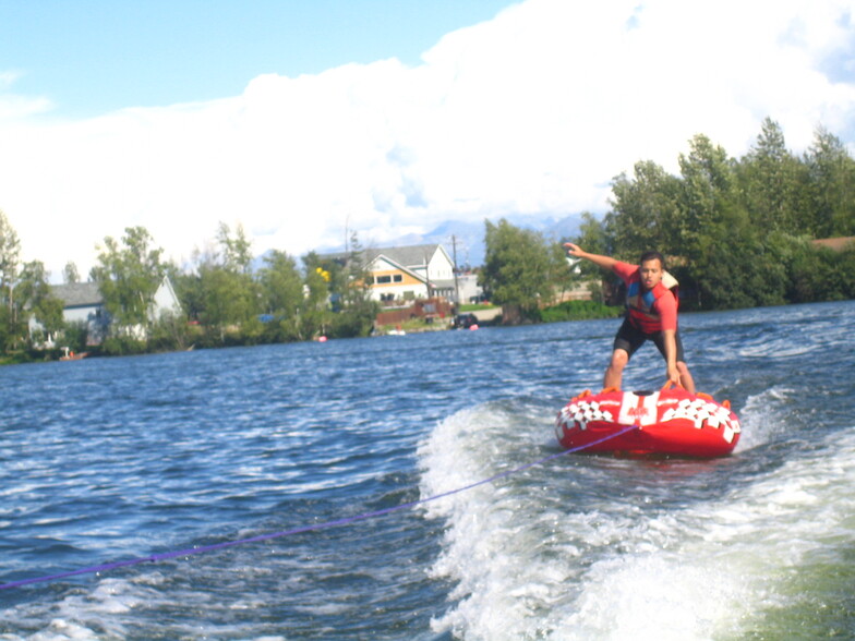 Triplex in background of lake fun. - 161 E Susitna Ave