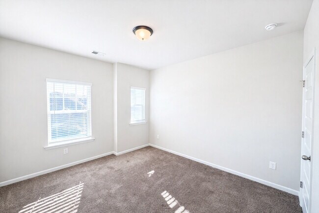 Building Photo - 3-bedroom Townhome in Buford City Schools with Quartz Kitchen, Private Suite, and Walkable Downto...