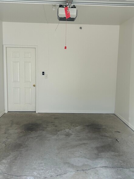 Garage Door to inside Condo Unit - 12833 Tradd St