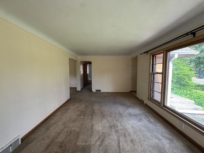 Building Photo - 3BR/1BA in Roseville Featuring A Sprawling Fenced Yard & An Attached Garage