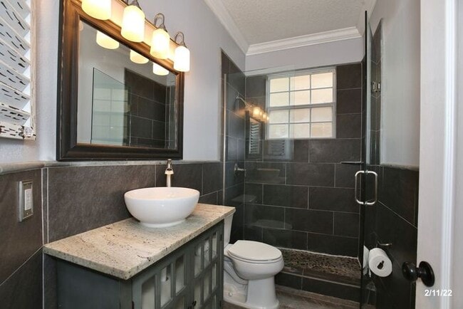 Building Photo - Luxurious 4/3 Waterfront Home with an In-ground Spa, an In-law Suite and a 2 Car Garage in the Hi...