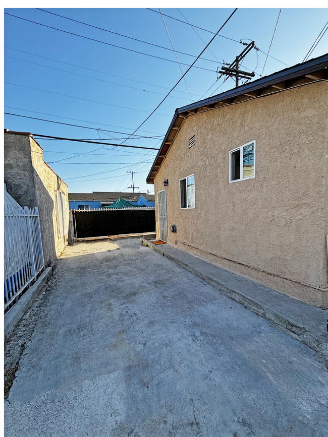 Main Driveway, can fit two compact cars. - 1334 E 92nd St