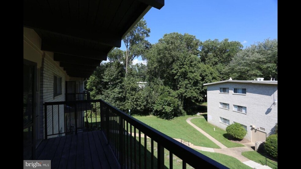 Oversized balcony with views of greenery and community - 4949 Americana Dr