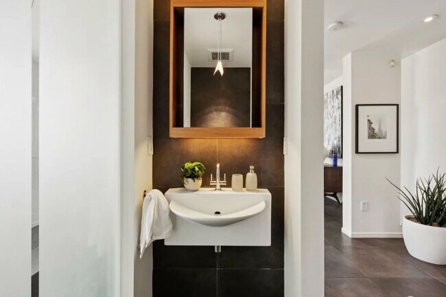 Building Photo - One-of-a-Kind Sophisticated Top-Floor Cond...