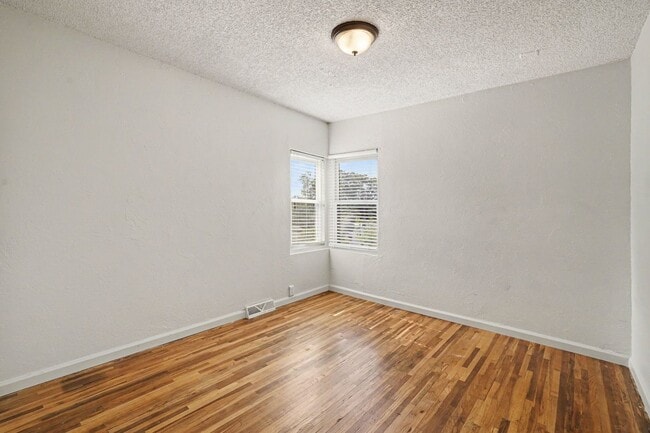 Building Photo - Spacious 4-Bedroom, 2-Bath Home with Large Yard, Garage & Central A/C