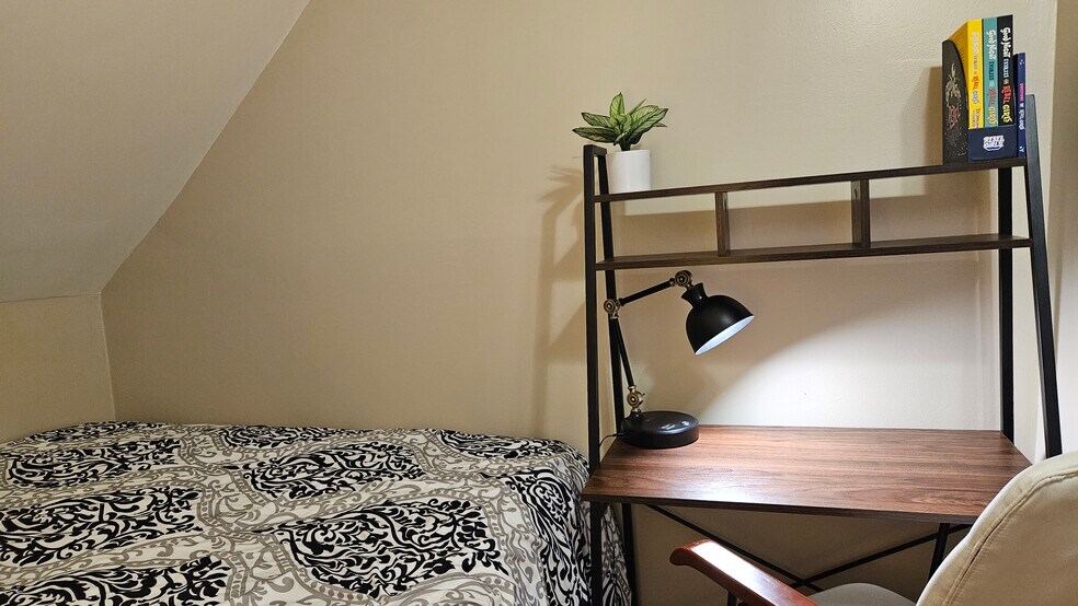 Workstation with Desk, Lamp, and Shelving in South Bedroom - 1901 -2301 Fillmore Street NE Minneapolis, MN 55418
