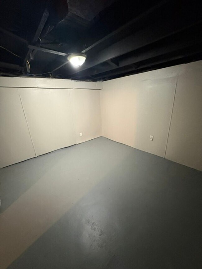 Building Photo - A cozy 2 bedroom home with versatile living space and plenty of storage including a partially fin...