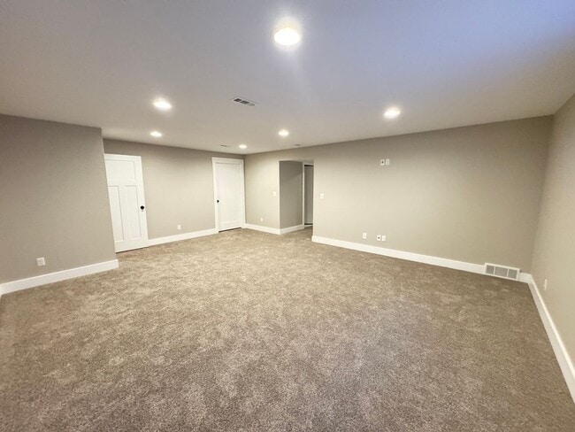 Building Photo - 4 BEDROOM, 3 BATHROOM TWINHOME WITH 2 CAR ATTACHED GARAGE IN NORTH CHEYENNE