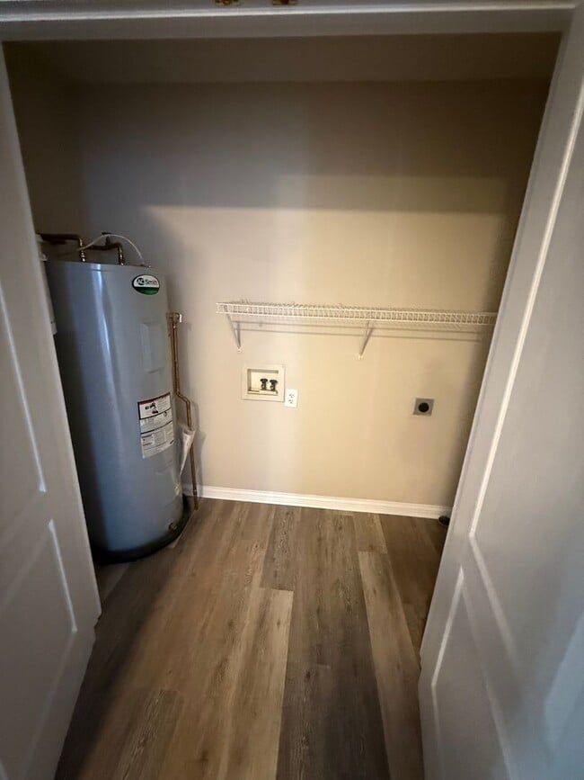 Building Photo - 2-bedroom, 1.5-bath townhouse with an attached garage