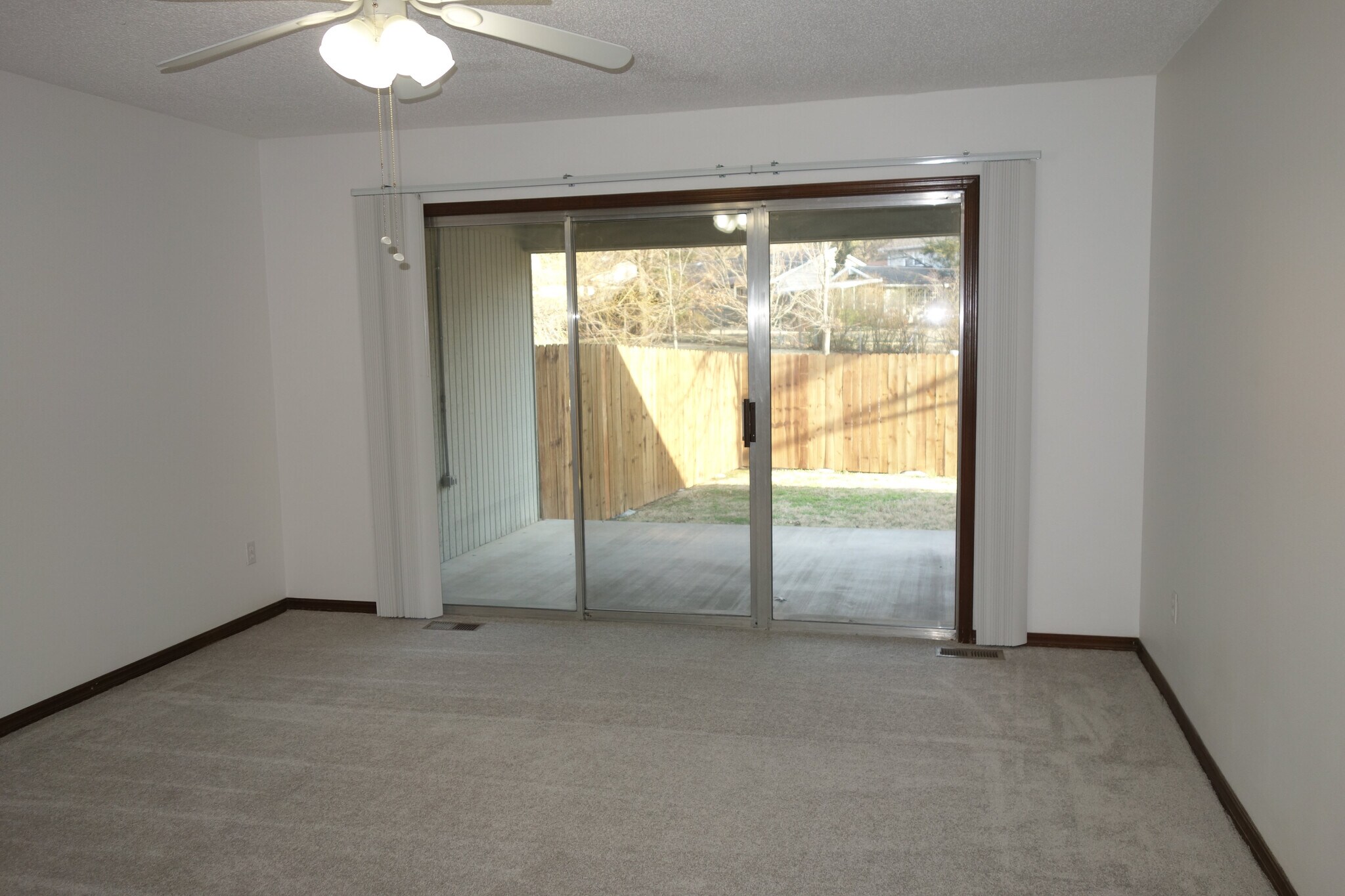 2nd bedroom with sliding door access to covered back patio - 3324 E 73rd St
