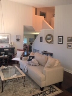 Living room partial picture to stairway to back door, and family room entrance/kitchen entrance. - 3809 Willie Mays Ln