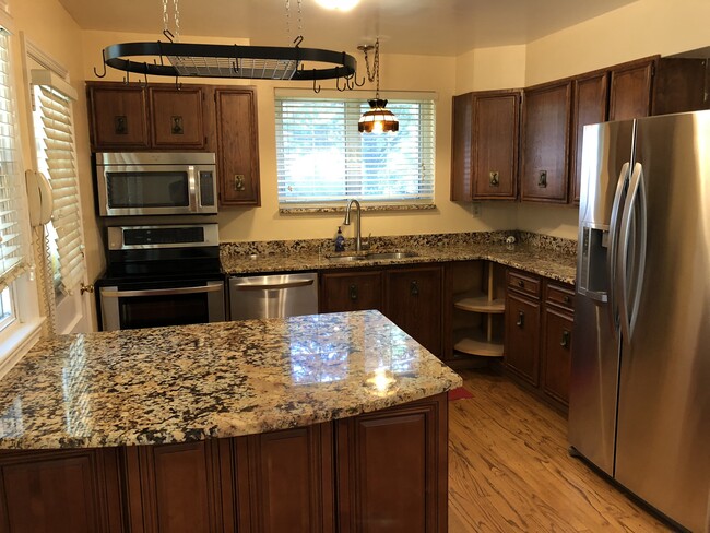 Kitchen with new SS appliances and granite countertops - 3805 jonesbridge road