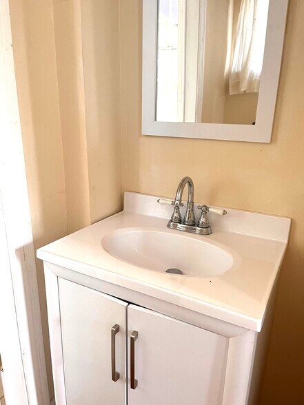 Half bath (pic is of downstairs unit but identical layout) - 2900 Palmer Ave