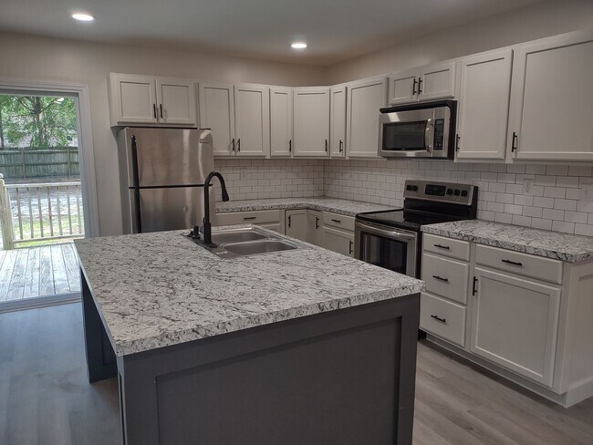 Building Photo - Tastefully Upgraded Four Bedroom Brick Hom...