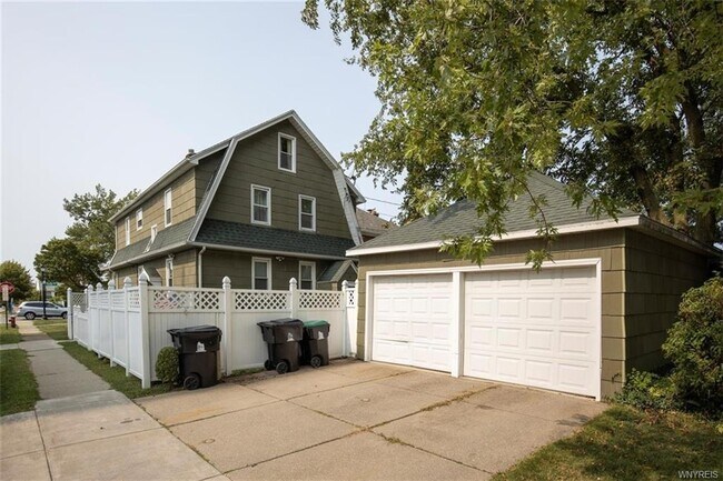 Each unit has its own garage space with opener - 679 Colvin Blvd
