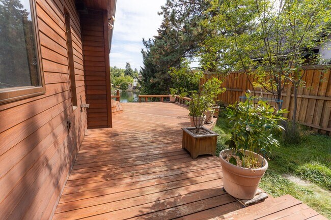 Building Photo - Private river access and stunning views from this home on Harmon Blvd! + Bonus Room