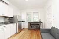 Building Photo - Furnished, Light-Filled Apartment With Utilities Included
