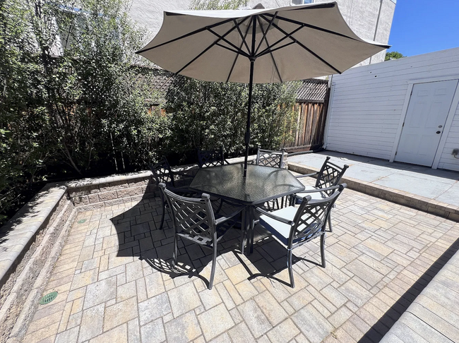 Chairs, table and umbrella included. Just needs a beverage! - 2108 E 23rd St