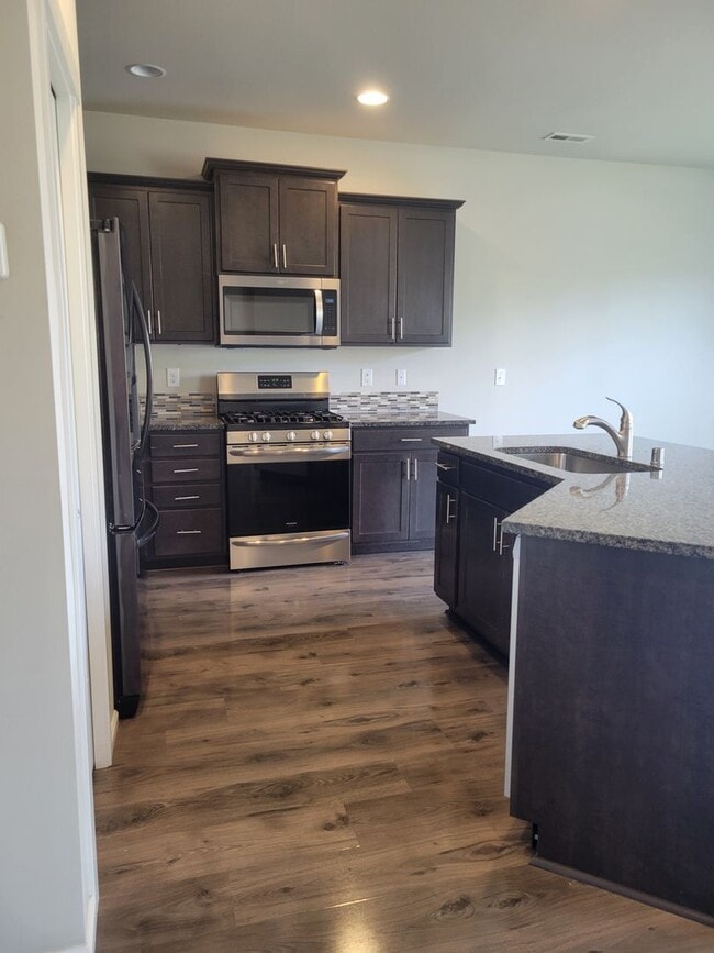 Building Photo - 3 bedroom home with 3 car garage on corner...