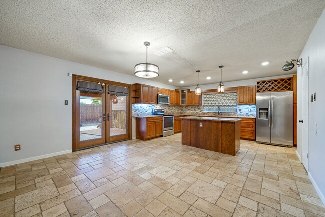Building Photo - Sign your lease and receive a FREE 50" TV!!!  "Spacious 4-Bedroom Retreat with Fireplace in Charm...