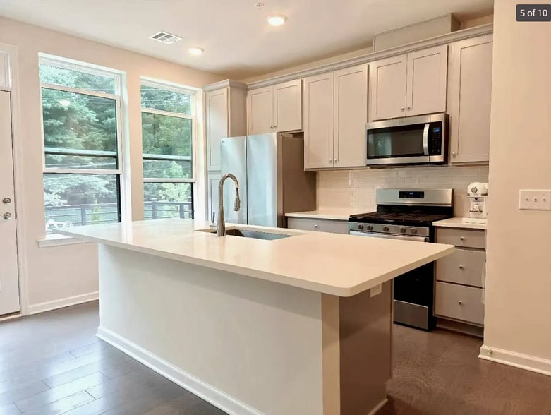 Kitchen island with exterior ventted hood - 806 Sadie Cir