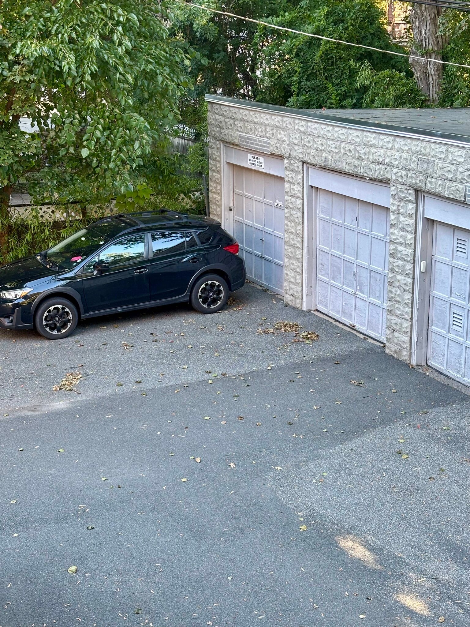 Garage and off-street parking spot in front of garage - 150 Wrentham St
