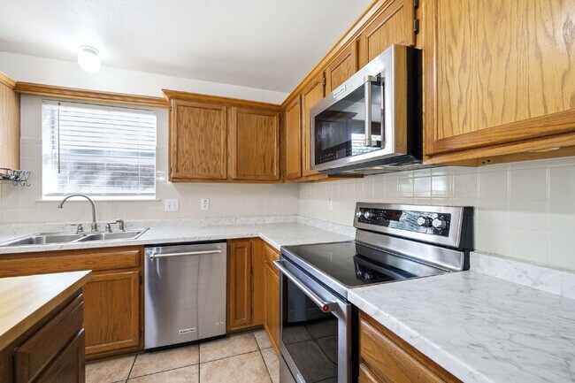 Building Photo - 4 Bedroom home with ZERO carpet close to RAFB
