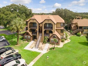 Building Photo - 1/1 Top Floor Condo in Gated Lakefront Com...