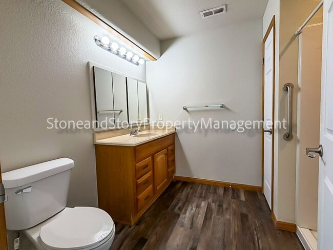 Building Photo - 2 bedroom 1.5 bath duplex with sunroom, 2 car garage and fenced yard