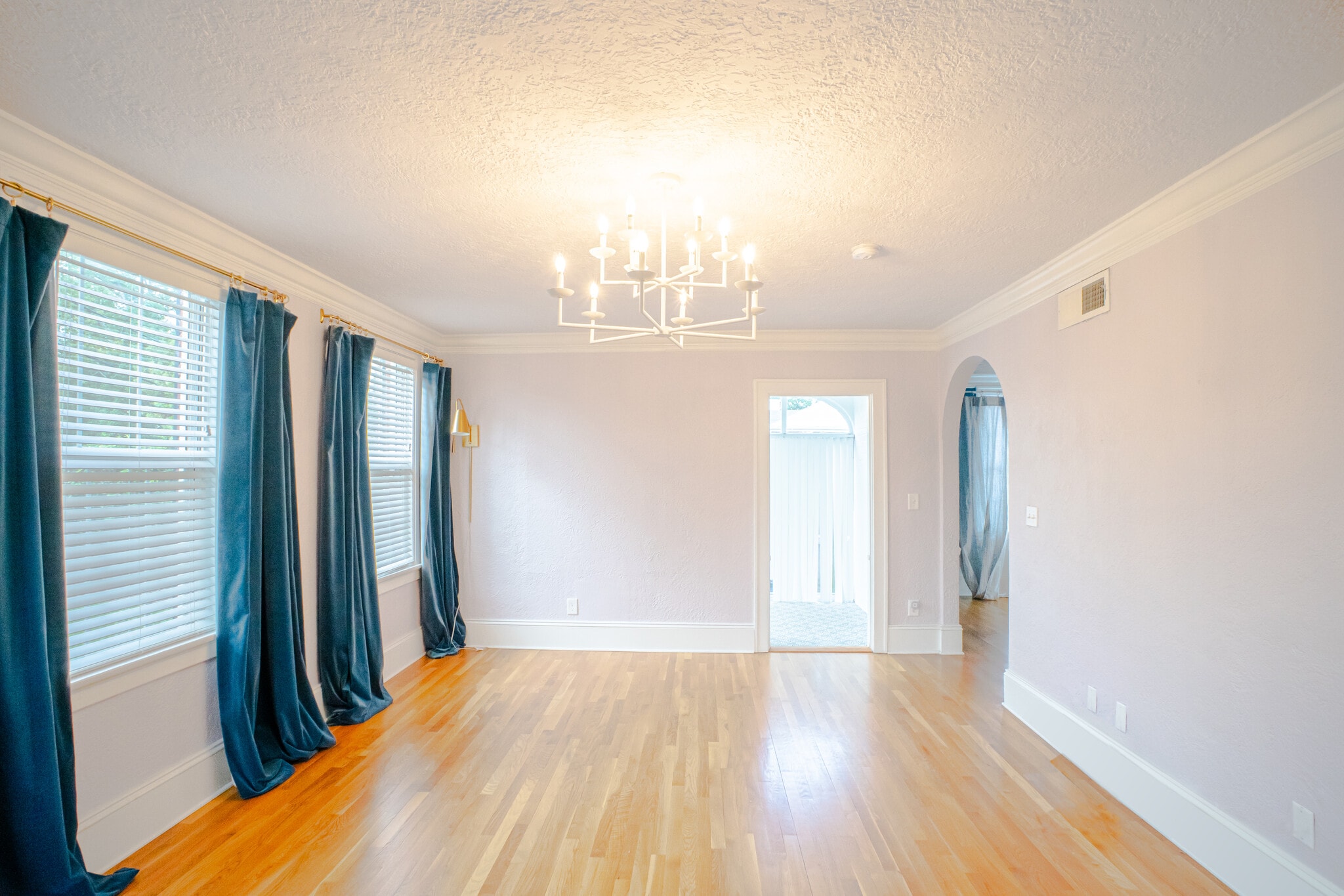 Living room looking at sunroom and arched dining entry - 1215 Landon Ave