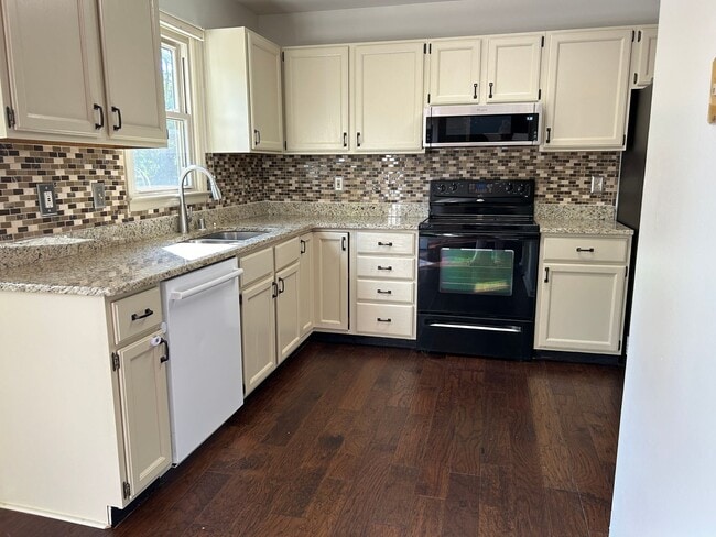 Building Photo - 4 Bedrooms with Finished Basement and Bonu...