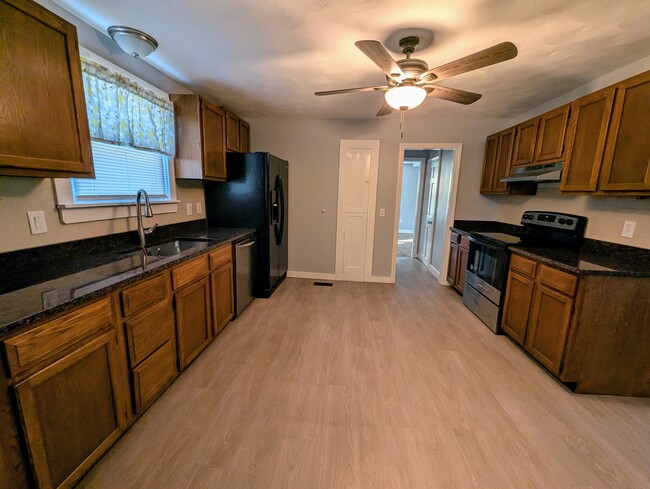 Kitchen with dishwasher, garage disposal and new granite countertops - 55 Makara St