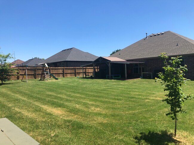 Backyard - fenced in from corner view - 337 N Sabine Pass Rd