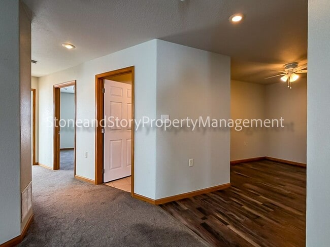 Building Photo - 2 bedroom 1.5 bath duplex with sunroom, 2 car garage and fenced yard