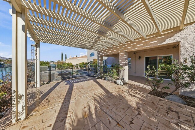 Building Photo - Luxury Lakefront Living in Desert Shores – 4 Bedroom Home with Private Dock & Stunning Views