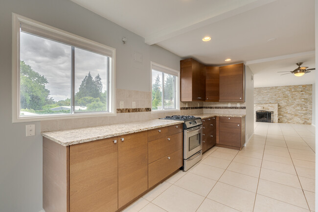 Generous counter space and gas stove are ready for their next chef! - 211 Farview Drive